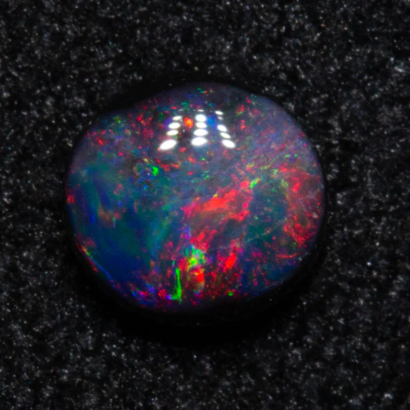 0.18 ct black opal 3.9x3.7x1.9mm
