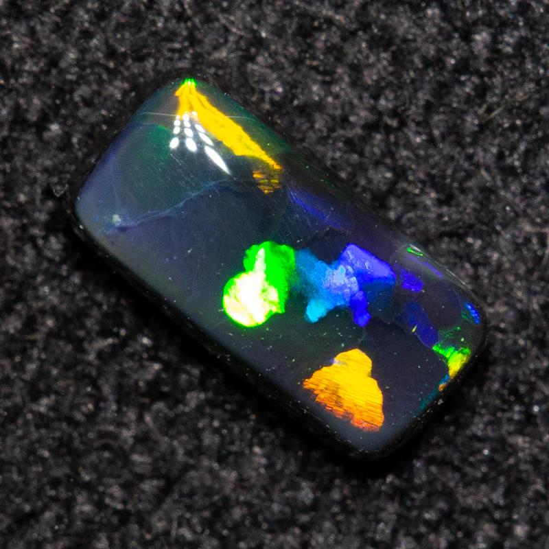 0.23 ct black opal 5.4x2.7x1.9mm