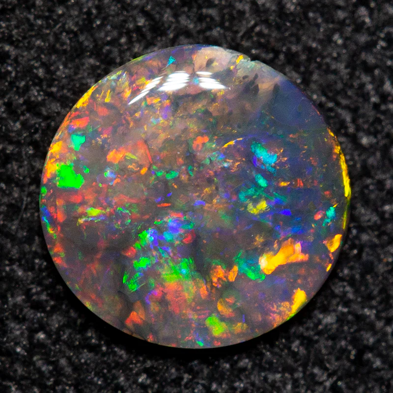 0.24 ct black opal 5.6x5.4x1.3mm