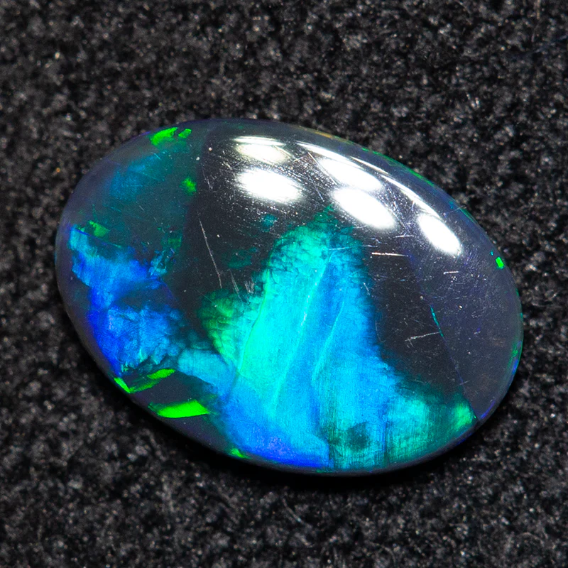 0.24 ct black opal 6.9x4.8x1.2mm