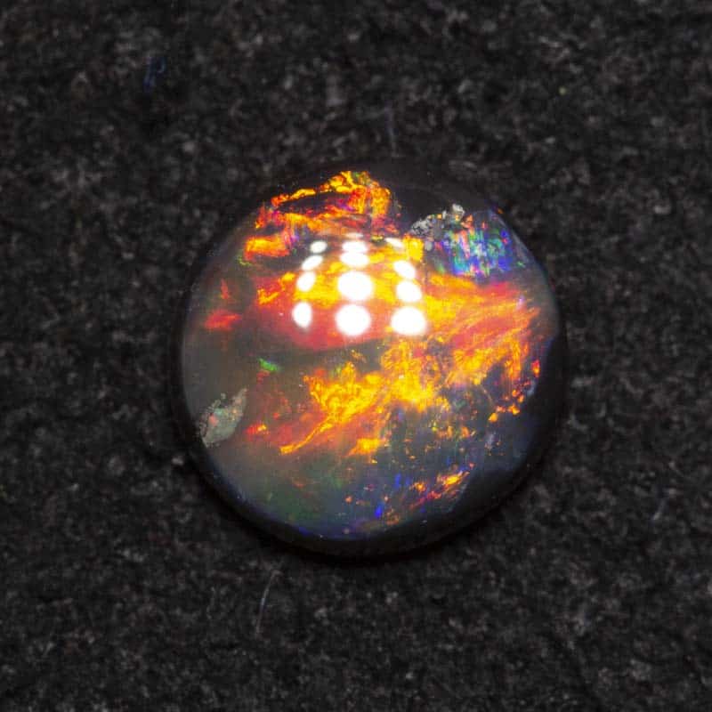 0.26 ct black opal 4.8x4.7x1.7mm
