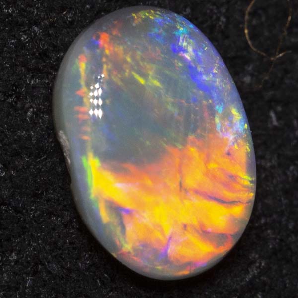 0.26 ct dark opal 5.2x3.7x1.9mm