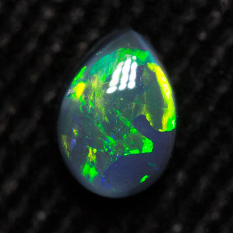 0.27 ct black opal 5.3x3.9x2.1mm