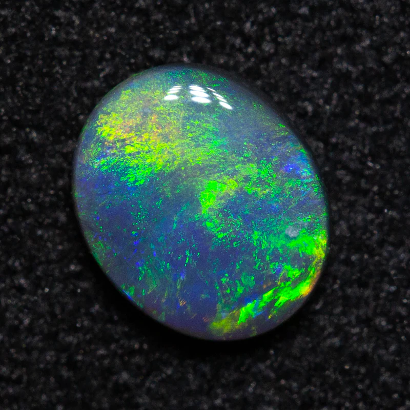 0.28 ct black opal 5.5x4.6x1.7mm