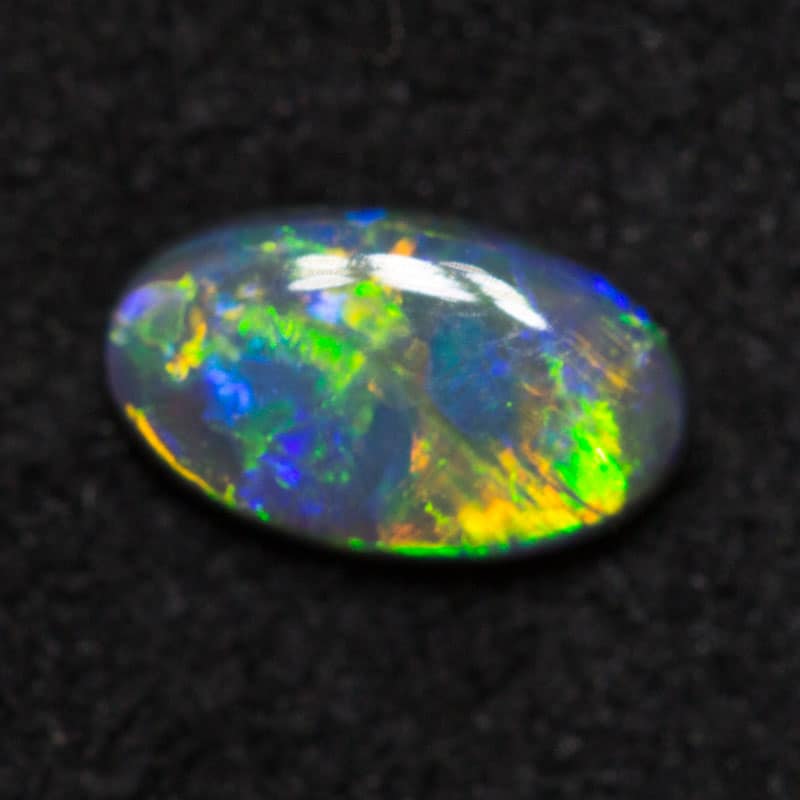 0.28 ct black opal 6.3x3.7x1.8mm
