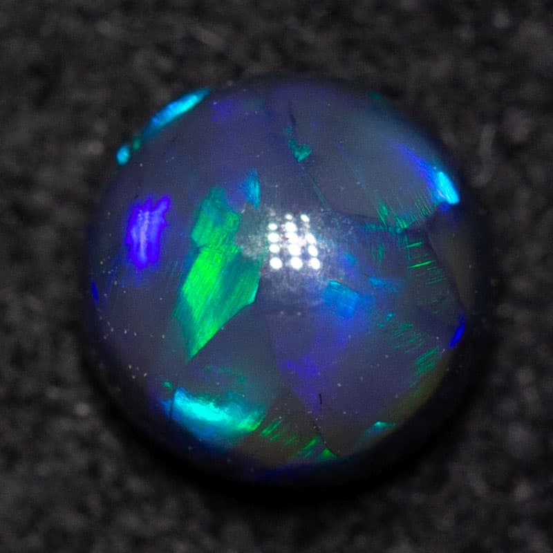 0.30 ct black opal round 4x4x3mm