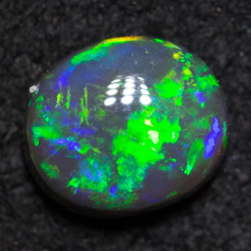 0.32 ct black opal 4.9x4.2x2.4mm