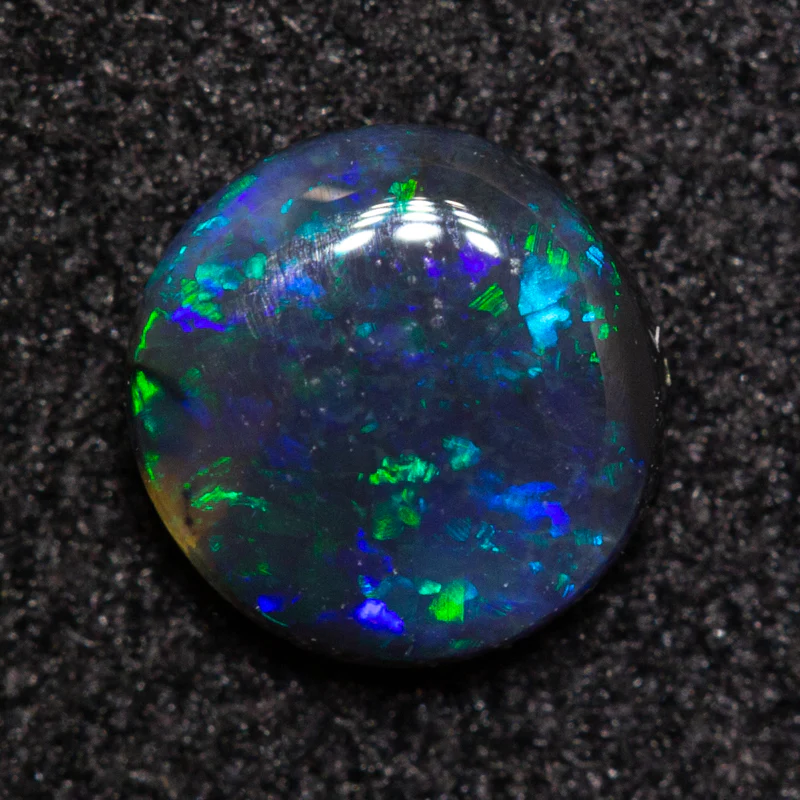 0.32 ct black opal 5.2x5.1x1.8mm