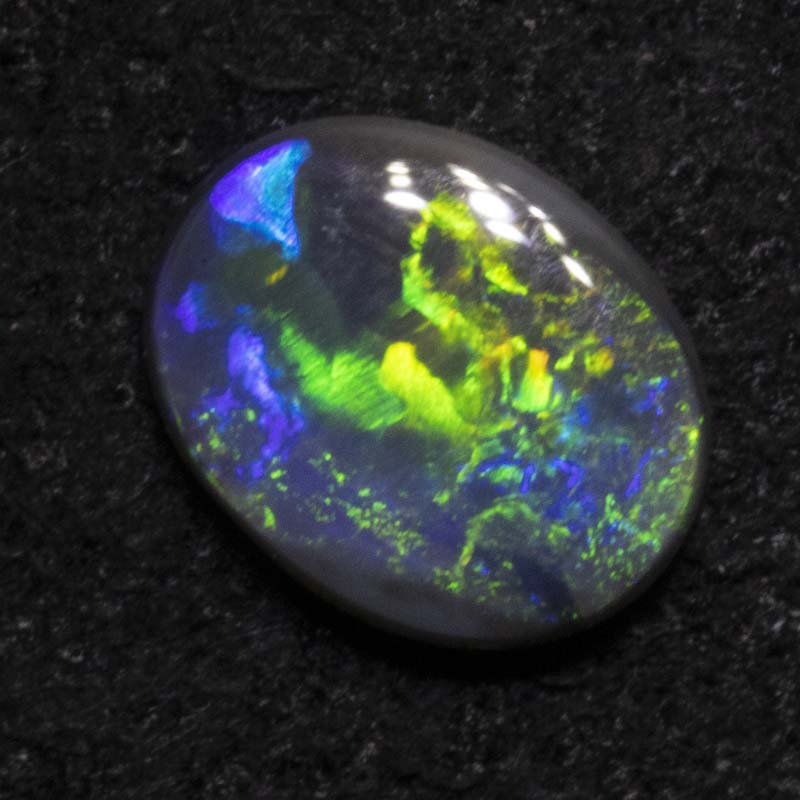 0.32 ct black opal 6.4x5.1x1.5mm