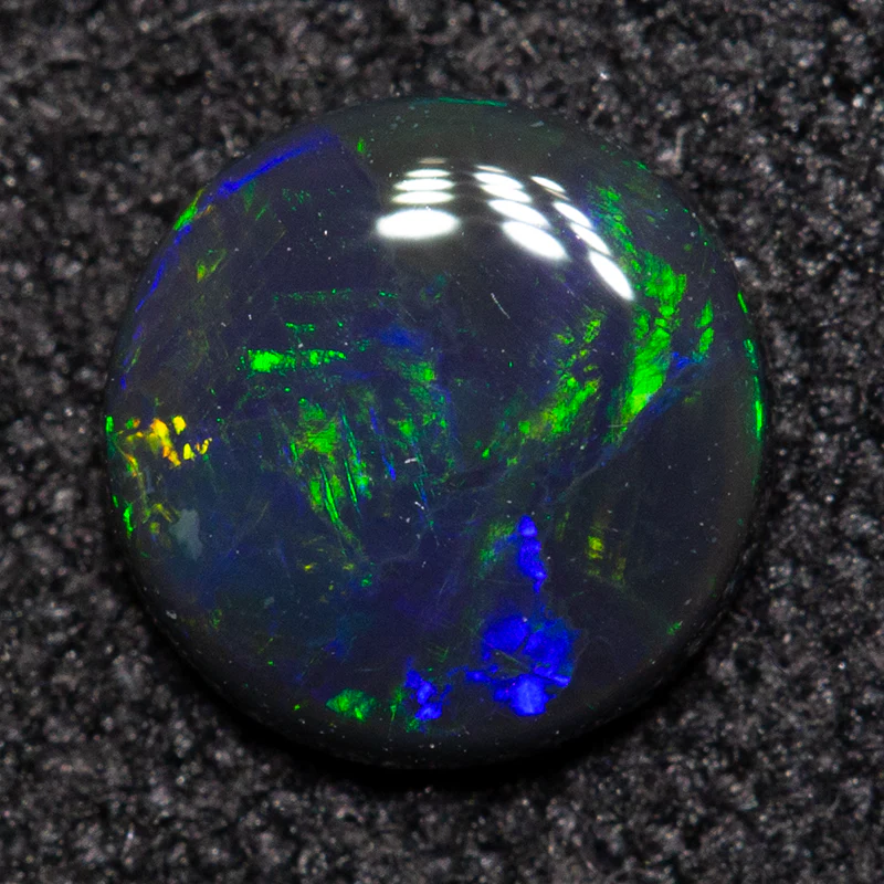 0.34 ct black opal 5.6x5.5x1.5mm