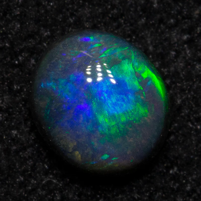 0.35 ct black opal 4.8x4.1x2.7mm