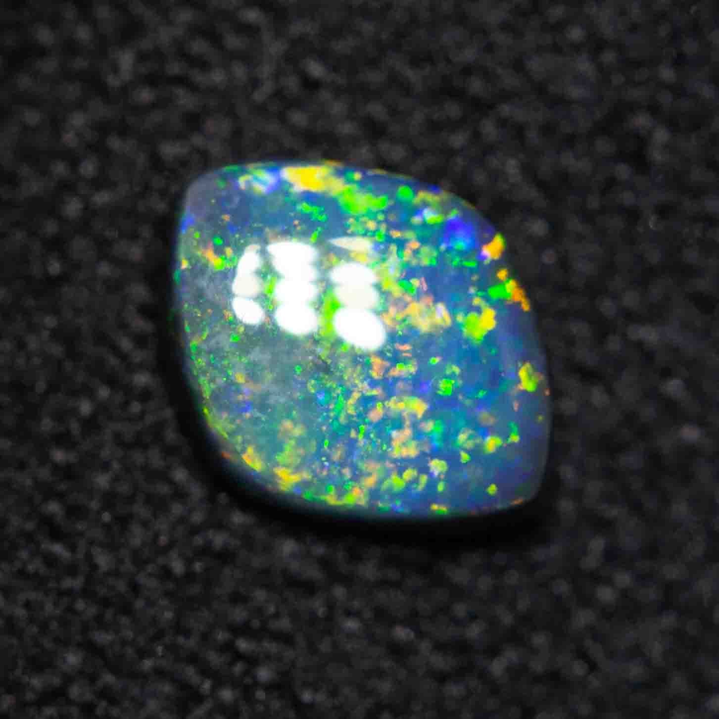 0.35 ct black opal 6.2x4.8x2mm