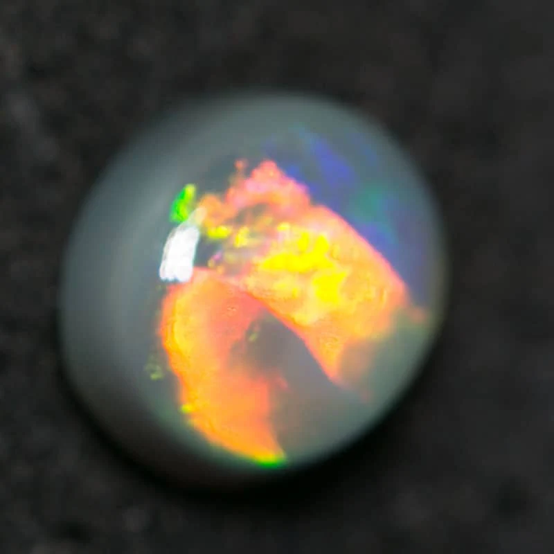 0.38 ct black opal 4.5x4x2mm