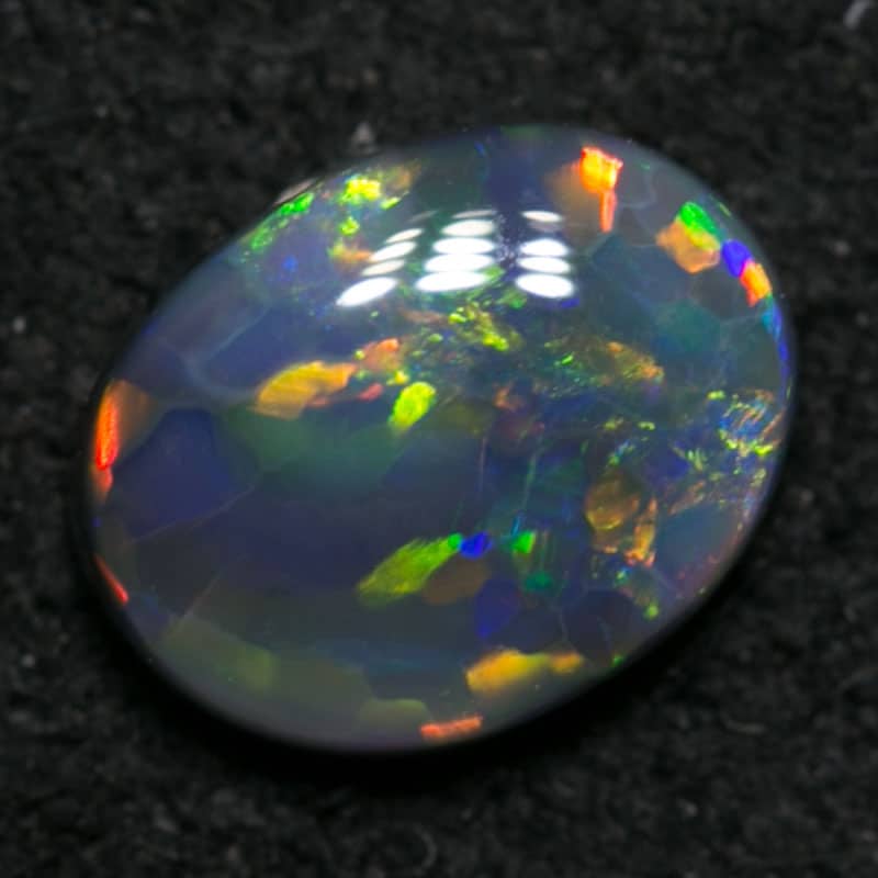 0.38 ct black opal 5.5x4.5x2mm