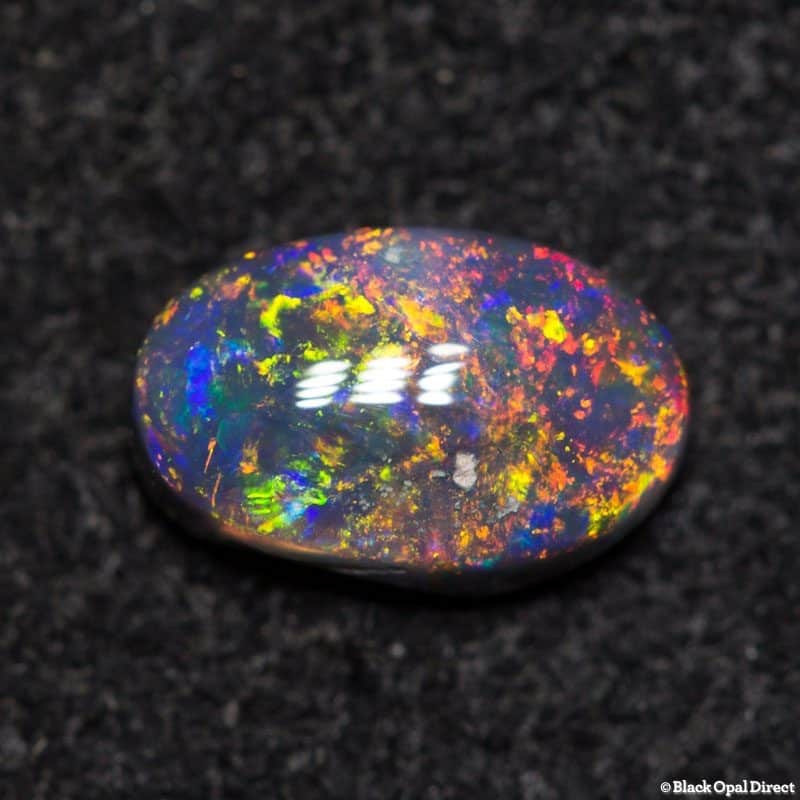 0.38 ct black opal 6x4.8x2mm