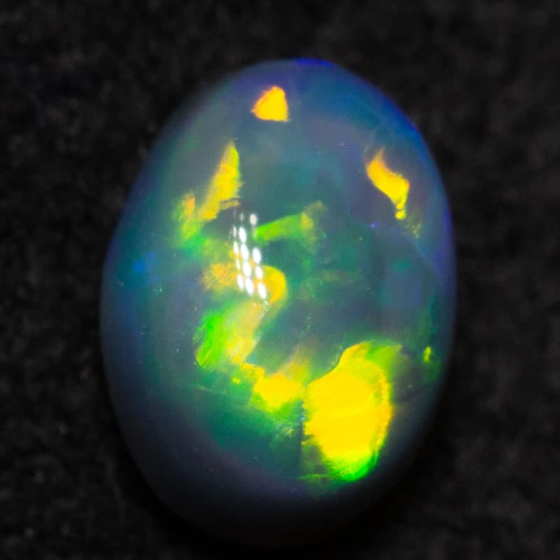 0.38 ct dark opal 5.4x4x2.8mm