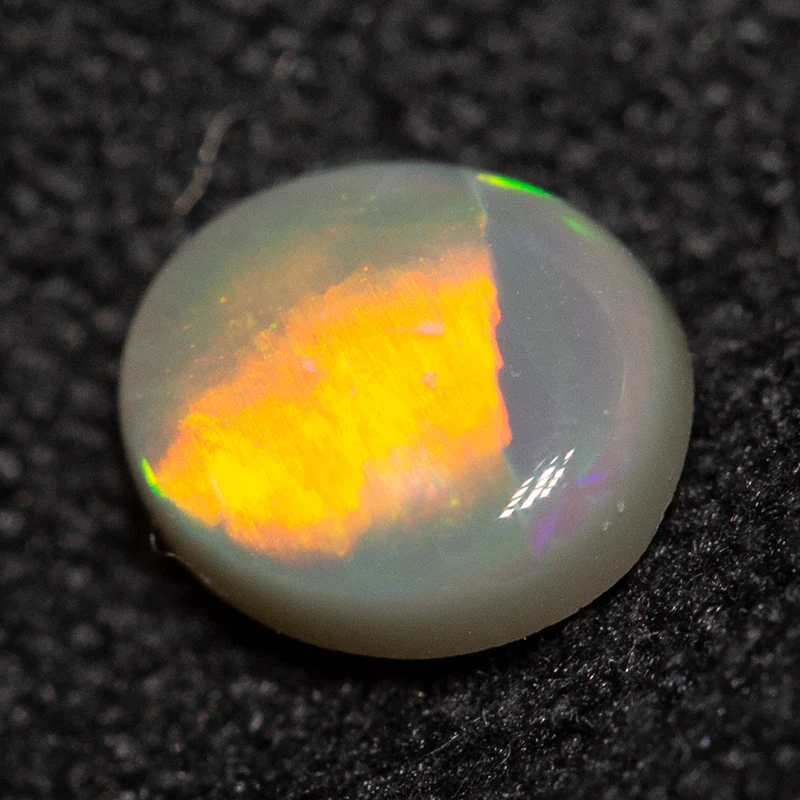 0.38 ct dark opal 5.5x4.5x2mm