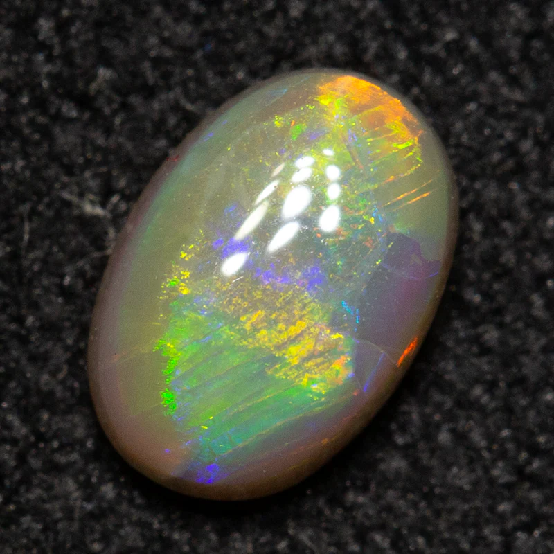 0.38 ct dark opal 5.8x4.1x2.4mm