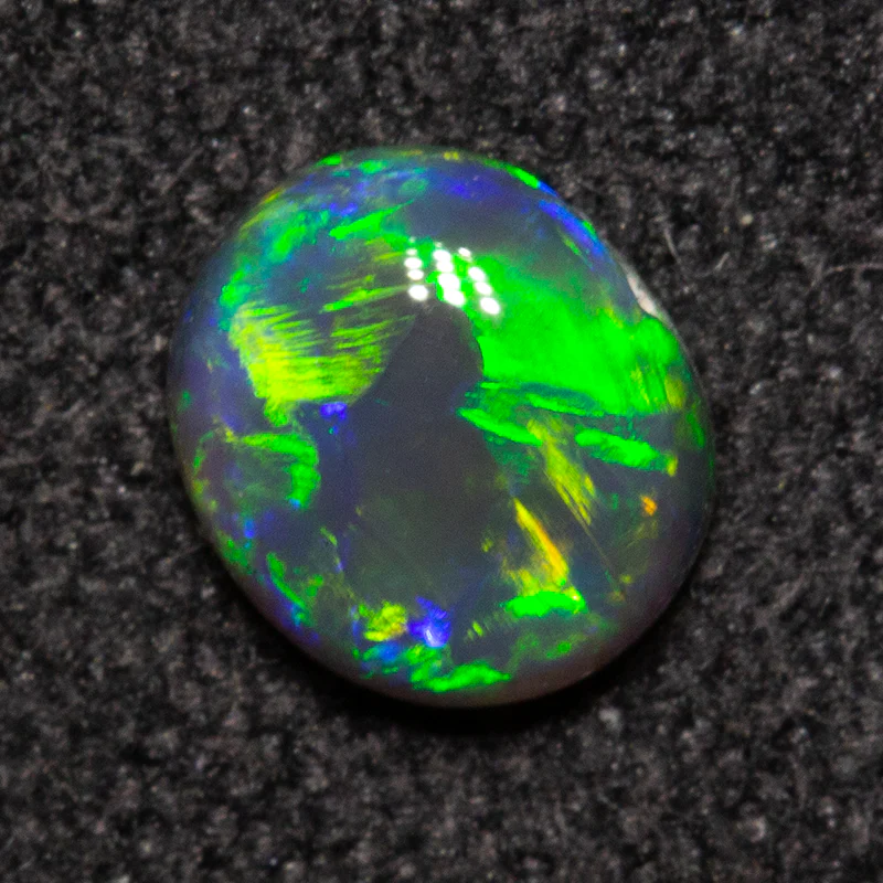 0.39 ct black opal 5.4x4.7x2.3mm