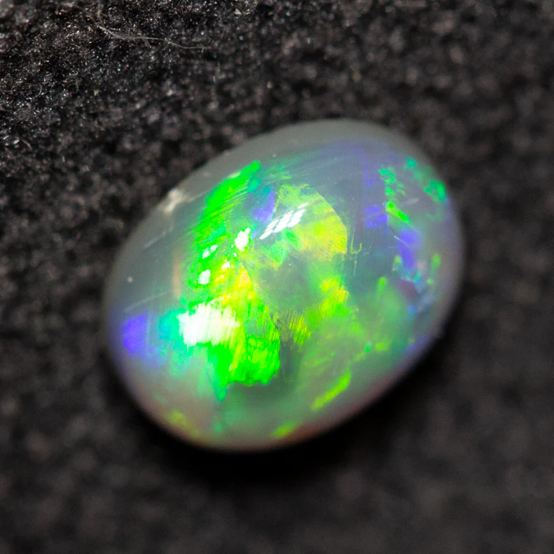 0.39 ct black opal 5.5x4.4x2.5mm