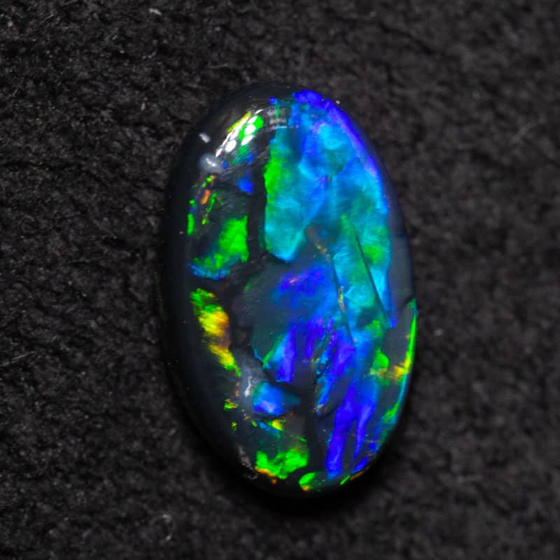 0.40 ct black opal 6.9x4.2x2mm