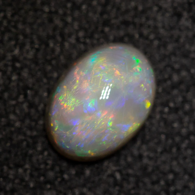 0.40 ct dark opal 5.9x4.3x2.6mm