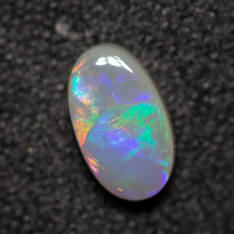 0.40 ct dark opal 6.5x3.9x2.1mm