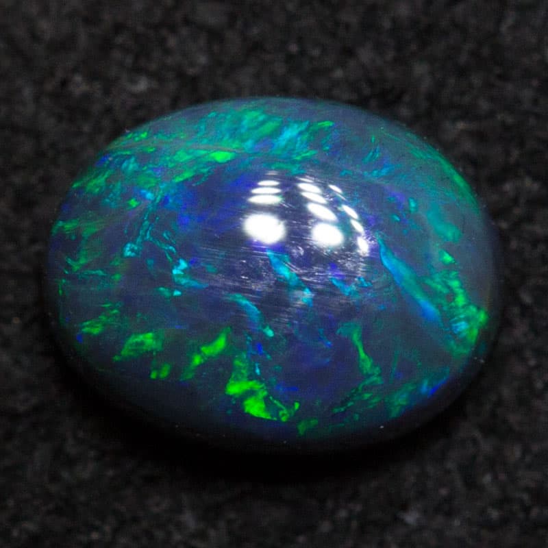 0.41 ct black opal 5.4x4.2x2.7mm