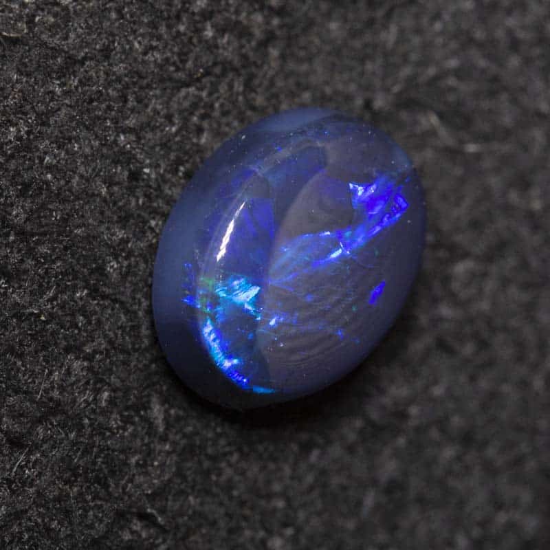 0.41 ct black opal 5.7x4.4x2.4mm