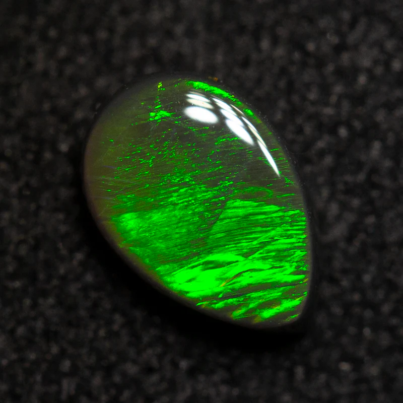0.41 ct black opal 6.1x4.2x2.2mm