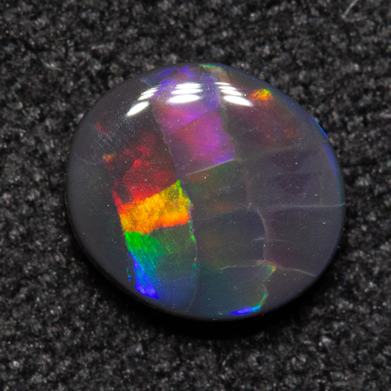 0.42 ct black opal 5.8x5.1x2.1mm