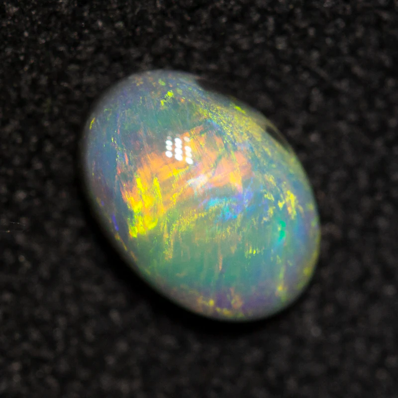 0.42 ct dark opal 6.4x4.5x2.5mm