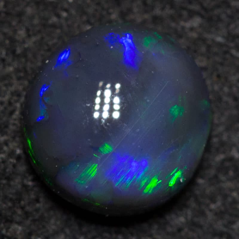 0.43 ct black opal 5.2mm roundx2.7mm