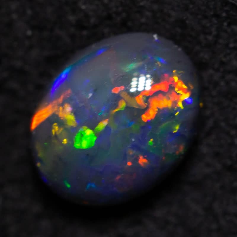 0.43 ct black opal 5.7x4.5x2.8mm