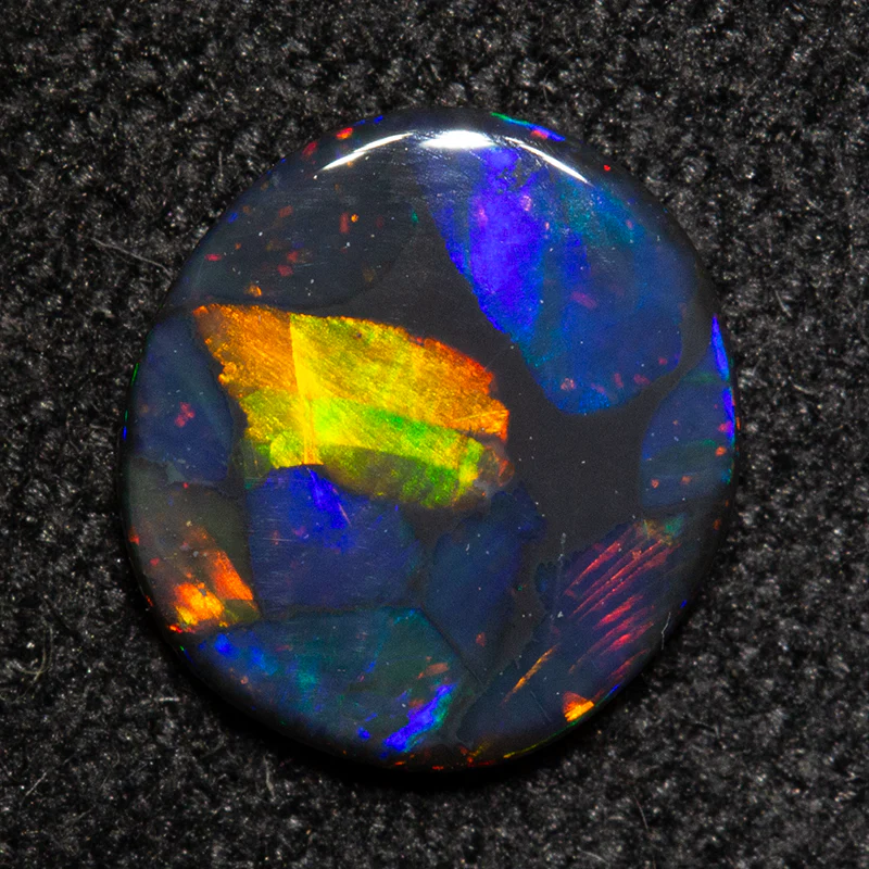 0.43 ct black opal 7.2x6.6x1.2mm