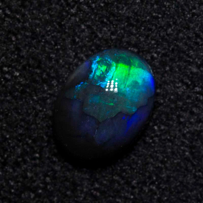 0.44 ct black opal 6x4.5x2.5mm