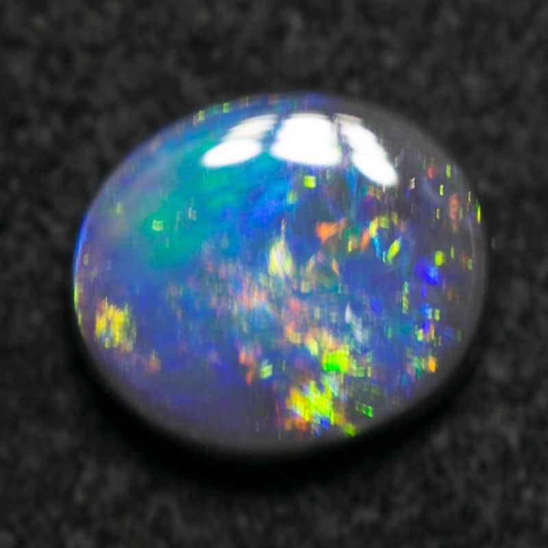0.46 ct black opal 5.5x5x2mm