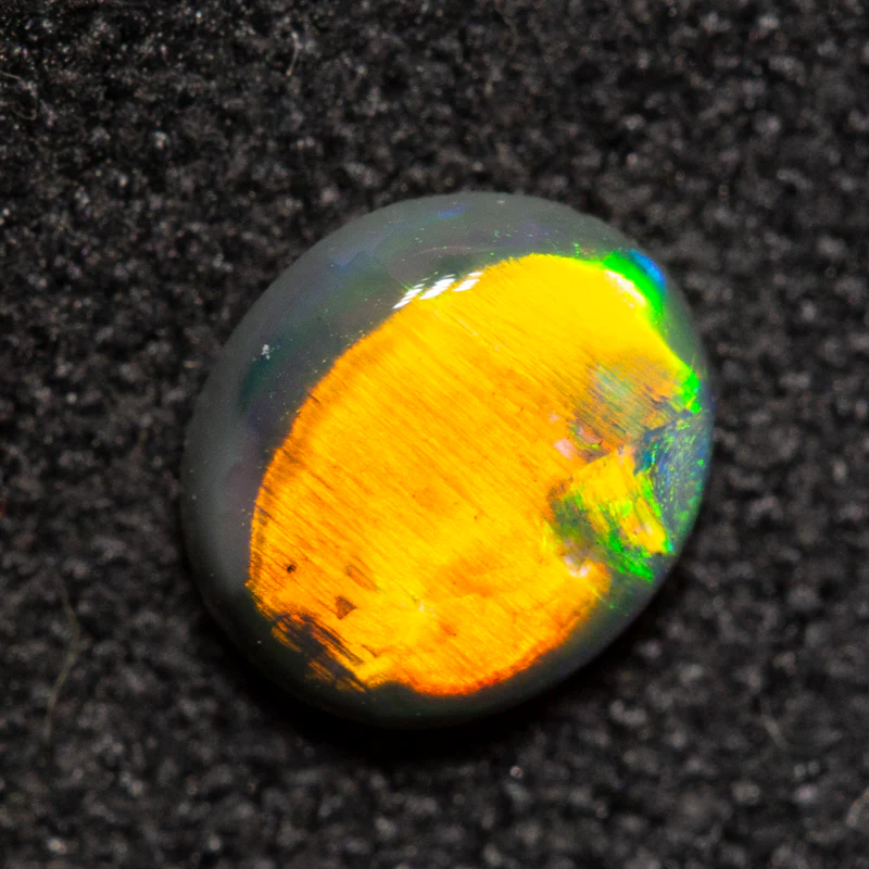 0.47 ct black opal 5.9x5.1x2.5mm