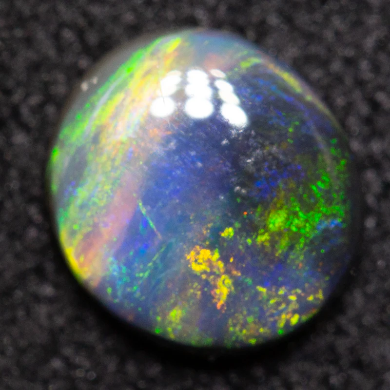 0.47 ct black opal 6.1x5.5x2.1mm