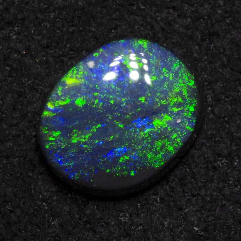 0.47 ct black opal 6.2x5.1x2.1mm