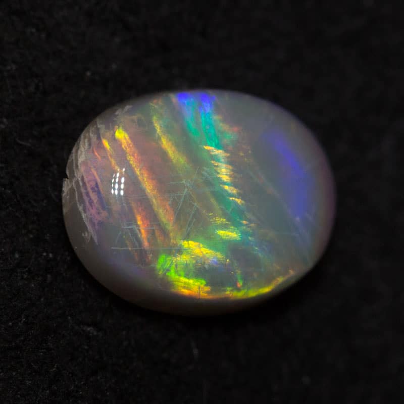 0.47 ct dark opal 6.3x4.9x2.3mm