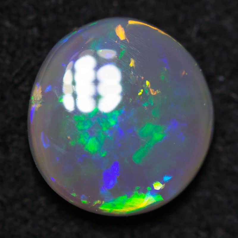 0.47 ct dark opal 6.5x5x2mm