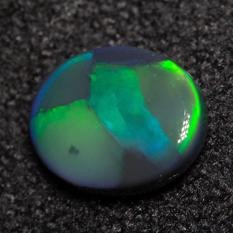 0.48 ct black opal 6.2x5.1x2.1mm