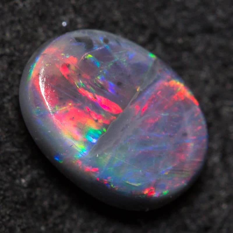 0.48 ct black opal 6.3x4.6x2.4mm