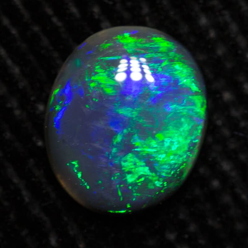 0.48 ct black opal 6.7x5.7x2mm