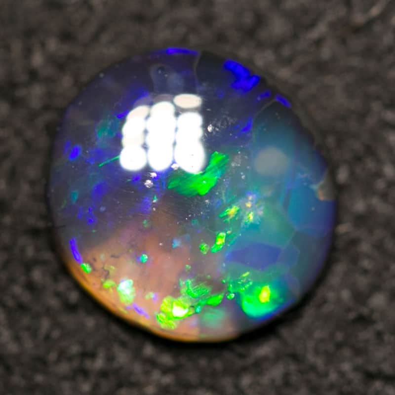 0.48 ct black opal 6mm round x2mm