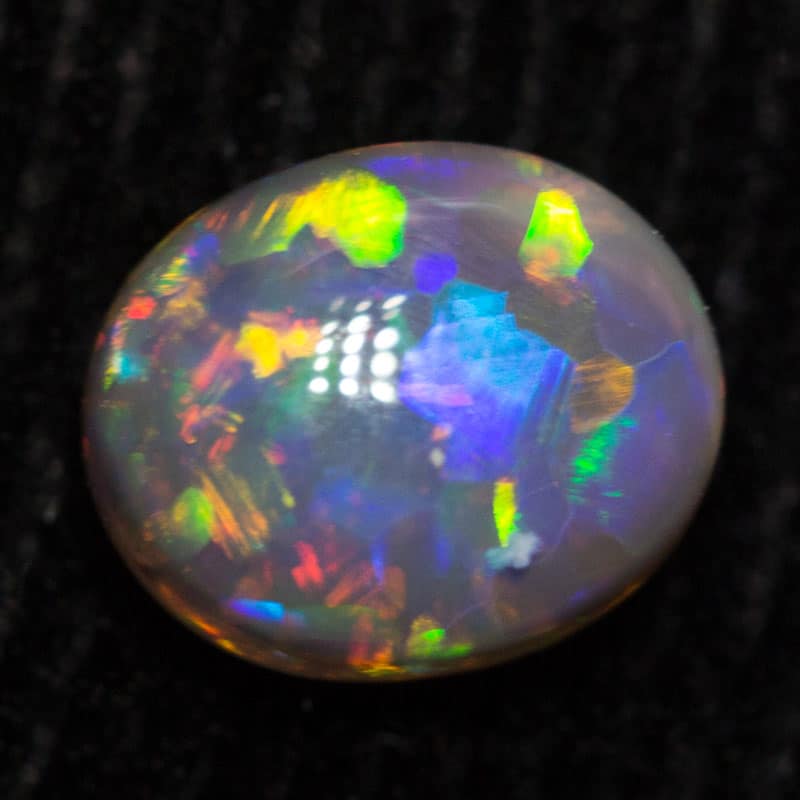0.49 ct black opal 5.9x4.9x2.7mm
