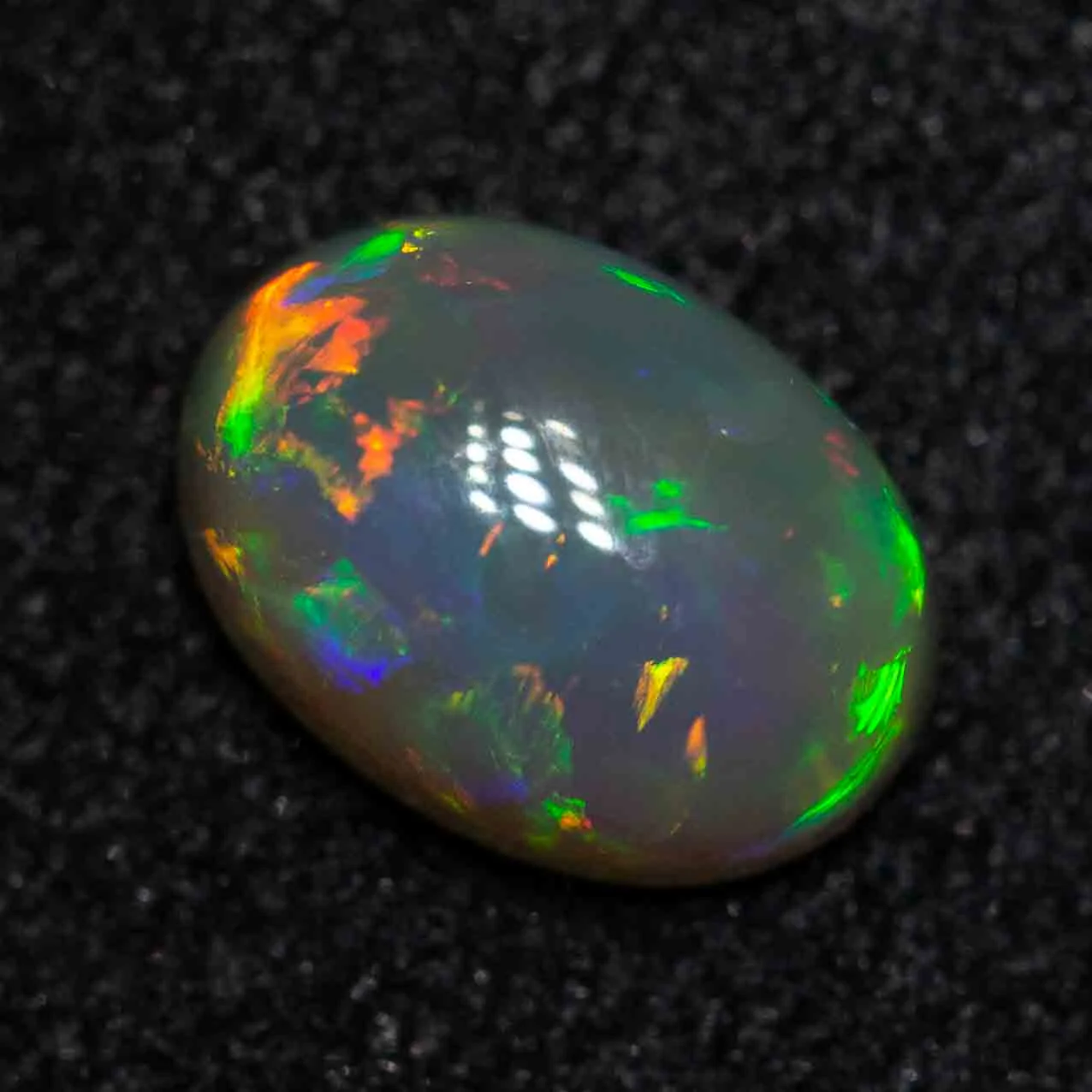 0.49 ct black opal 6.1x4.4x2.8mm