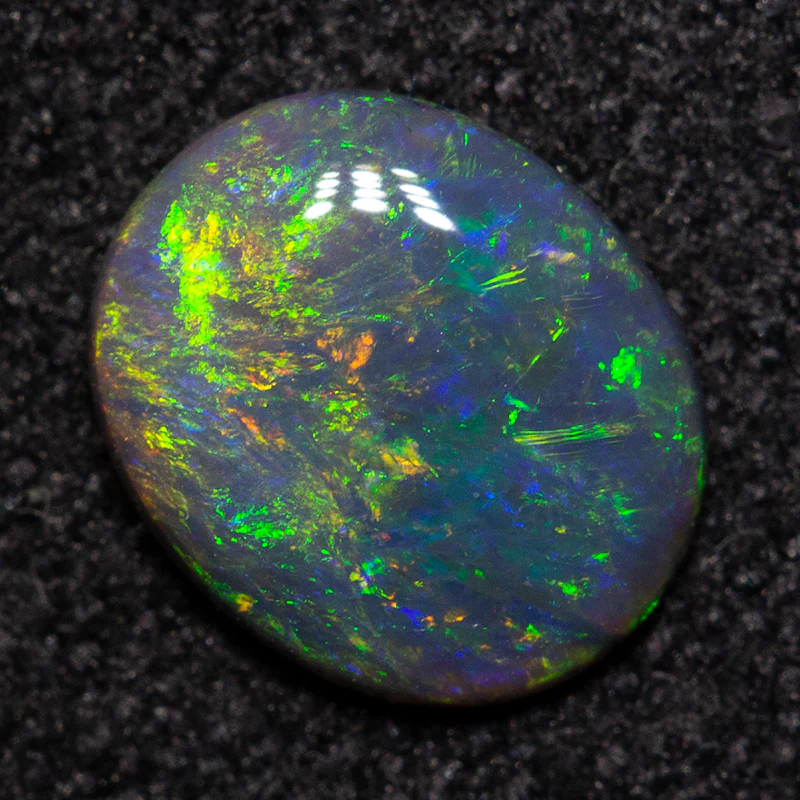 0.49 ct black opal 6.9x5.7x1.7mm