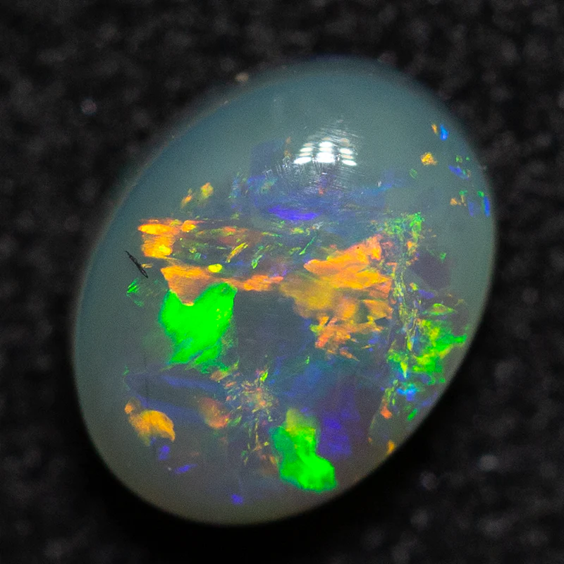 0.49 ct dark opal 5.7x4.5x2.8mm